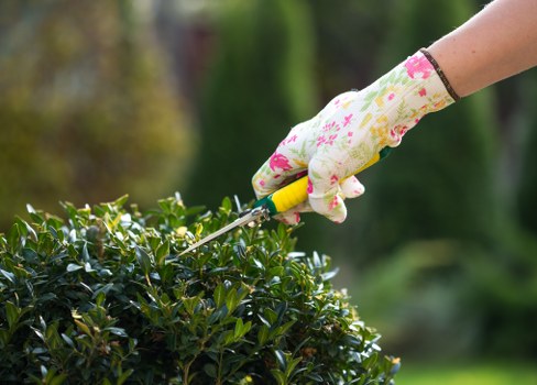 Gardener preparing tools and safety gear at the start of a shift